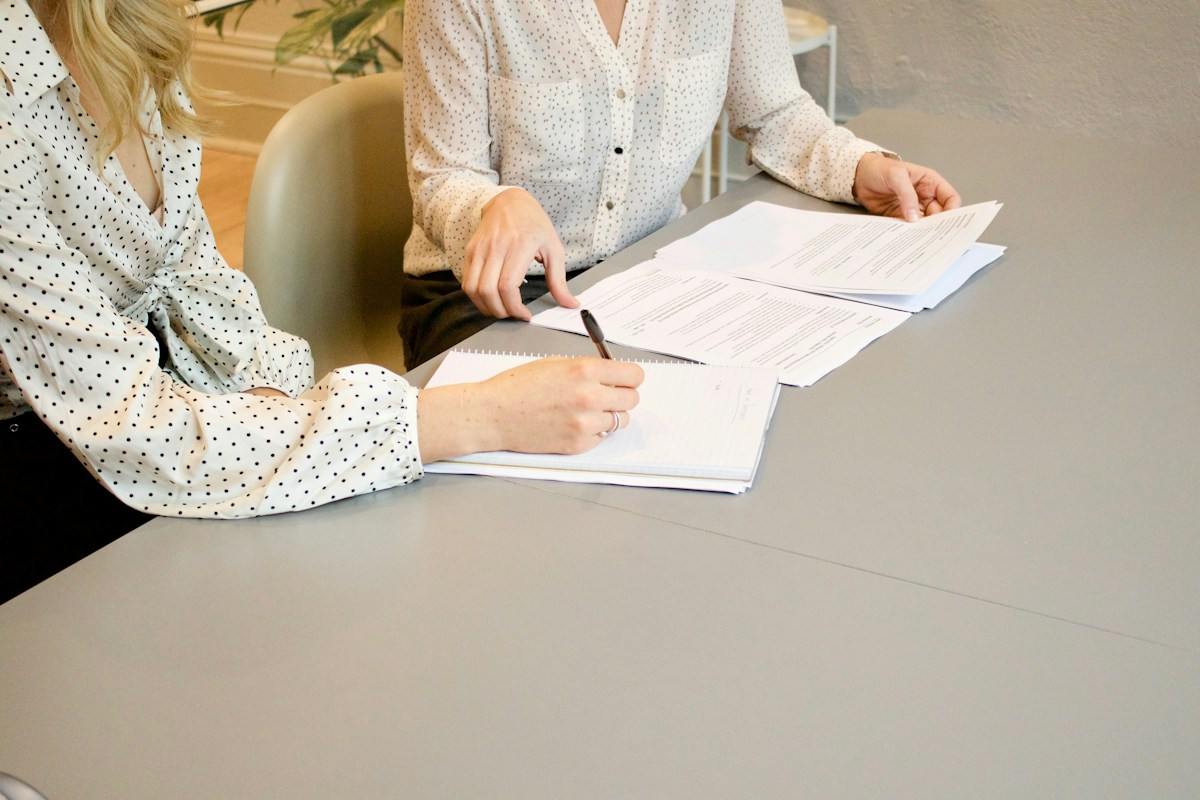 Advisers reviewing paperwork together